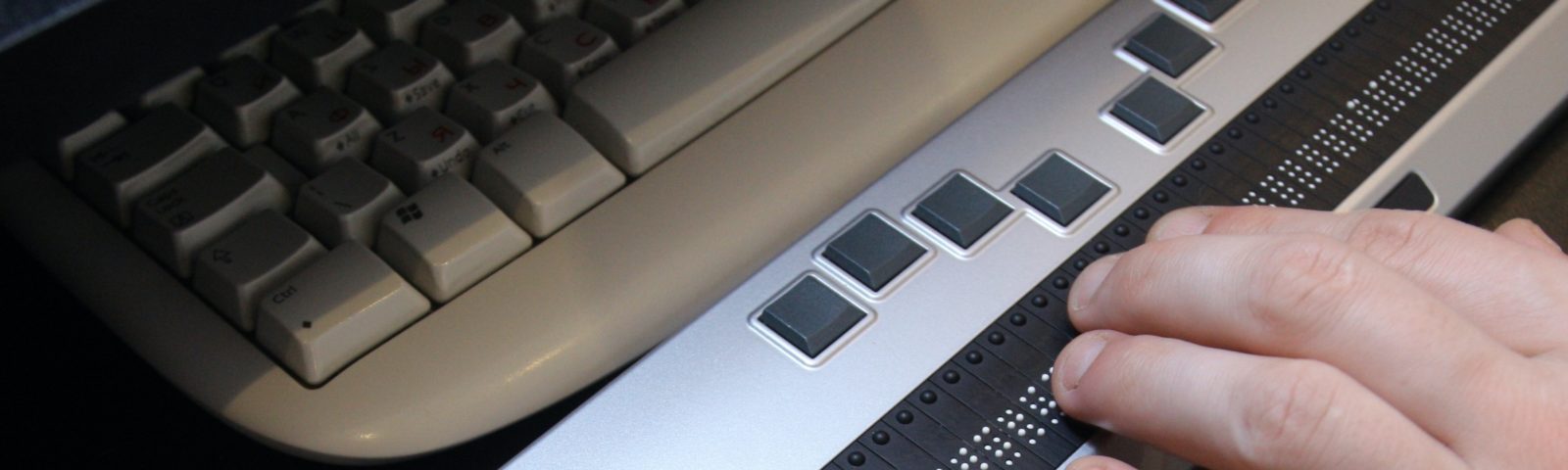 hands using braille keyboard